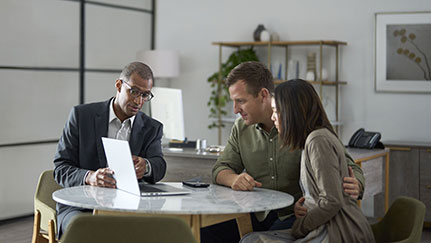 Couple engaging with a financial professional in an office setting