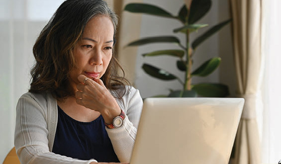 Woman working on a laptop.