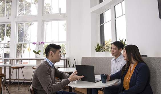 A financial professional assisting a couple.