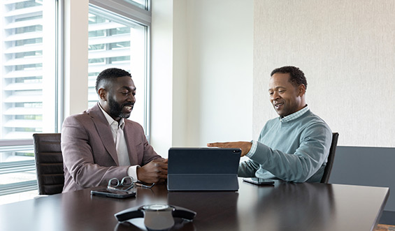 Two men discuss the stock market.