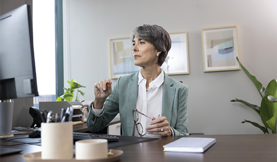 Business woman sitting at desk.