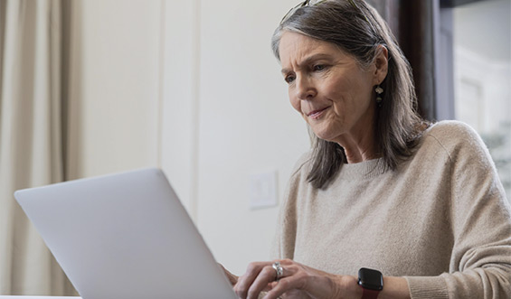 A woman types on a computer.