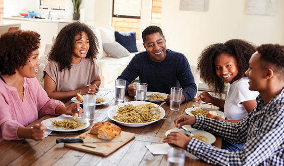 A blended family gathers at the table.