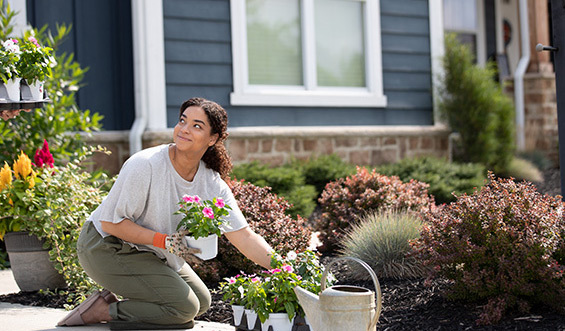 A person gardening happily.