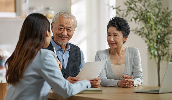 A couple discusses estate planning with a financial advisor.