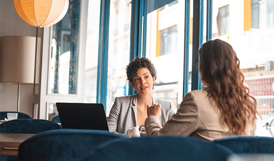 Two women in a meeting.