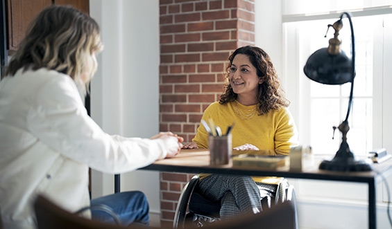 Two women in a meeting.