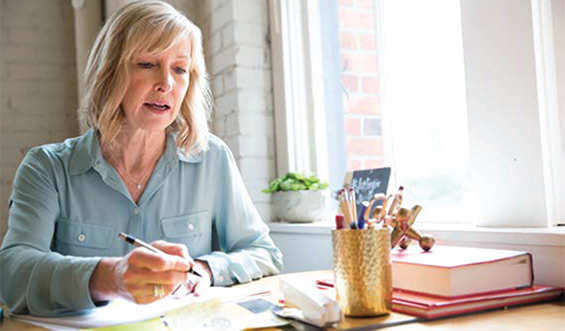 A woman reviews documents.