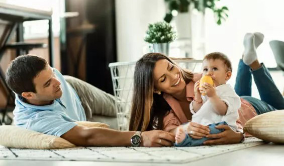 Couple enjoying time with a baby