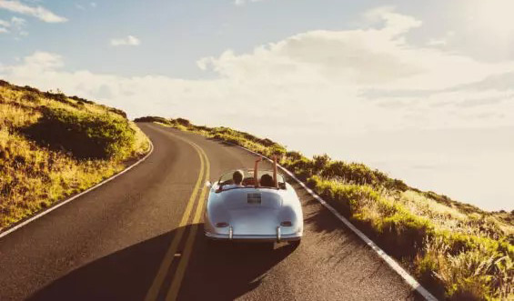 A convertible car on the road