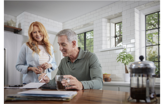 couple reviewing papers at the kitchen table